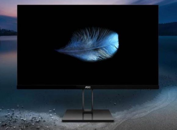 Monitor para ordenador mostrando una pluma, con un paisaje nocturno de colinas y un río al fondo. Qué monitor comprar 2021